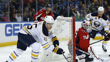 Jan 16, 2016; Buffalo, NY, USA; Buffalo Sabres center Jack Eichel (15) brings the puck from behind Washington Capitals goalie Braden Holtby (70) during the second period at First Niagara Center. Mandatory Credit: Kevin Hoffman-USA TODAY Sports