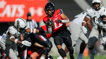 Cincinnati Bearcats running back Ryan Montgomery runs the ball against the UCF Knights. USA Today.