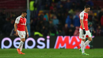 BARCELONA, SPAIN - MARCH 16: Mesut Ozil (R) and Alexis Sanchez (L) of Arsenal leave the pitch at the half time during the UEFA Champions League round of 16, second Leg match between FC Barcelona and Arsenal FC at Camp Nou on March 16, 2016 in Barcelona, Spain. (Photo by Richard Heathcote/Getty Images)