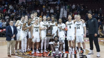 Nov 21, 2021; Uncasville, CT, USA; The Purdue Boilermakes pose with the Hall of Fame Tip Off Tournament Trophy after the game against the Villanova Wildcats at Mohegan Sun Arena. Mandatory Credit: Gregory Fisher-USA TODAY Sports