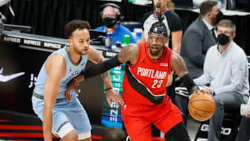 Apr 23, 2021; Portland, Oregon, USA; Portland Trail Blazers power forward Robert Covington (23) dribbles the ball as Memphis Grizzlies small forward Kyle Anderson (left) defends during the first half at Moda Center. (Soobum Im-USA TODAY Sports)
