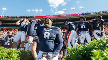 AUBURN, AL - NOVEMBER 3: Defensive lineman Coynis Miller Jr. #8 of the Auburn Tigers celebrates with teammates after defeating the Texas A&M Aggies at Jordan-Hare Stadium on November 3 2018 in Auburn, Alabama. (Photo by Michael Chang/Getty Images)