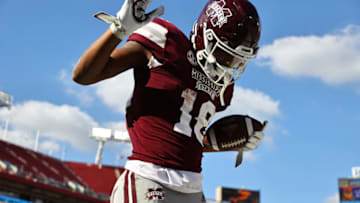 Jan 2, 2023; Tampa, FL, USA; Mississippi State Bulldogs wide receiver Justin Robinson (18) celebrates after he scored a touchdown against the Illinois Fighting Illini during the second half in the 2023 ReliaQuest Bowl at Raymond James Stadium. Mandatory Credit: Kim Klement-USA TODAY Sports