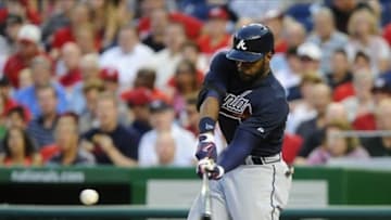 Aug 5, 2013; Washington, DC, USA; Atlanta Braves right fielder Jason Heyward (22) hits a single during the third inning against the Washington Nationals at Nationals Park. Mandatory Credit: Brad Mills-USA TODAY Sports