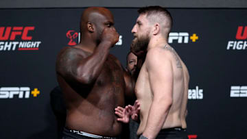 LAS VEGAS, NEVADA - DECEMBER 17: (L-R) Opponents Derrick Lewis and Chris Daukaus face off during the UFC Fight Night weigh-in at UFC APEX on December 17, 2021 in Las Vegas, Nevada. (Photo by Jeff Bottari/Zuffa LLC)