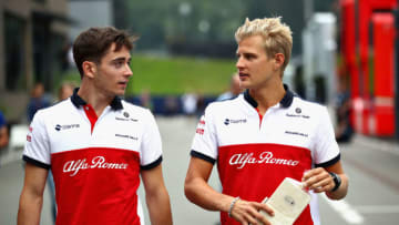 SPIELBERG, AUSTRIA - JUNE 29: Charles Leclerc of Monaco and Sauber F1 and Marcus Ericsson of Sweden and Sauber F1 talk in the Paddock after practice for the Formula One Grand Prix of Austria at Red Bull Ring on June 29, 2018 in Spielberg, Austria. (Photo by Mark Thompson/Getty Images)