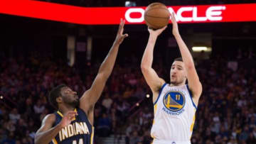 January 7, 2015; Oakland, CA, USA; Golden State Warriors guard Klay Thompson (11) shoots the basketball against Indiana Pacers forward Solomon Hill (44) during the first quarter at Oracle Arena. Mandatory Credit: Kyle Terada-USA TODAY Sports