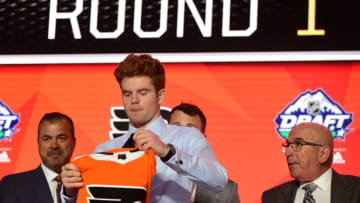 Jun 21, 2019; Vancouver, BC, Canada; Cameron York puts on a jersey after being selected as the number fourteen overall pick to the Philadelphia Flyers in the first round of the 2019 NHL Draft at Rogers Arena. Mandatory Credit: Anne-Marie Sorvin-USA TODAY Sports