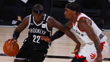 LAKE BUENA VISTA, FLORIDA - AUGUST 17: Caris LeVert #22 of the Brooklyn Nets drives against Rondae Hollis-Jefferson #4 of the Toronto Raptors during the second quarter in Game One of the Eastern Conference First Round during the 2020 NBA Playoffs at AdventHealth Arena at ESPN Wide World Of Sports Complex on August 17, 2020 in Lake Buena Vista, Florida. (Photo by Kevin C. Cox/Getty Images)