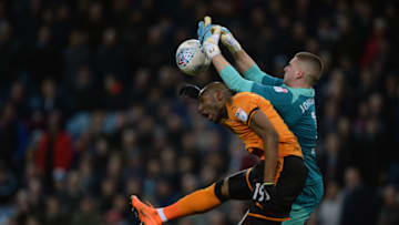 BIRMINGHAM, ENGLAND - MARCH 10: Benik Afobe of Wolverhampton Wanderers and Sam Johnstone of Aston Villa in action during the Sky Bet Championship match between Aston Villa and Wolverhampton Wanderers at Villa Park on March 10, 2018 in Birmingham, England. (Photo by Nathan Stirk/Getty Images,)