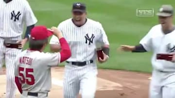 Alex Rodriguez and Jorge Posada swarm Hideki Matsui