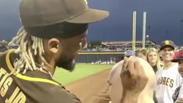 San Diego Padres SS Fernando Tatis signs a cancer patient's head upon her request at Spring Training.