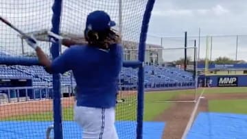 Blue Jays third baseman Vladimir Guerrero Jr. follows through his swing at a Spring Training batting practice session.