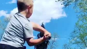 The little kid hitting bombs off his dad in their backyard is back!