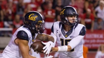 Oct 10, 2015; Salt Lake City, UT, USA; California Golden Bears quarterback Jared Goff (16) hands off to running back Daniel Lasco (2) during the first half against the Utah Utes at Rice-Eccles Stadium. Utah won 30-24. Mandatory Credit: Russ Isabella-USA TODAY Sports