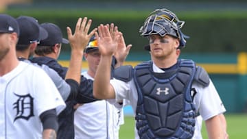 DETROIT, MI - AUGUST 01: John Hicks #55 of the Detroit Tigers high-fives teammates after the victory against the Cincinnati Reds at Comerica Park on August 1, 2018 in Detroit, Michigan. The Tigers defeated the Reds 7-4. (Photo by Mark Cunningham/MLB Photos via Getty Images)