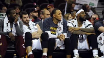 Dec 28, 2014; Cleveland, OH, USA; Cleveland Cavaliers guard Dion Waiters (3) and Cleveland Cavaliers forward Kevin Love (0) and Cleveland Cavaliers forward Shawn Marion (31) and Cleveland Cavaliers forward LeBron James (23) sit on the bench during the fourth quarter against the Detroit Pistons at Quicken Loans Arena. The Pistons won 103-80. Mandatory Credit: Ken Blaze-USA TODAY Sports