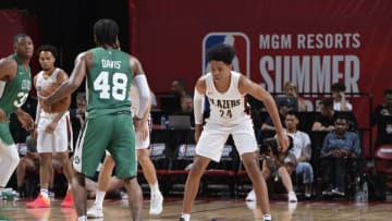 LAS VEGAS, NV - JULY 15: Trey Davis #48 of the Boston Celtics handles the ball against Anfernee Simons #24 of the Portland Trail Blazers during the 2018 Las Vegas Summer League on July 15, 2018 at the Thomas & Mack Center in Las Vegas, Nevada. NOTE TO USER: User expressly acknowledges and agrees that, by downloading and/or using this photograph, user is consenting to the terms and conditions of the Getty Images License Agreement. Mandatory Copyright Notice: Copyright 2018 NBAE (Photo by David Dow/NBAE via Getty Images)