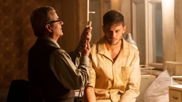 TREADSTONE -- Episode 101 -- Pictured: (l-r) Martin Umbash as Dr. Meisner, Jeremy Irvine as J. Randolph Bentley -- (Photo by: Jonathan Hession/USA Network)
