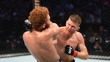 TAMPA, FLORIDA - OCTOBER 12: (R-L) Matt Frevola punches Luis Pena of Italy in their lightweight bout during the UFC Fight Night event at Amalie Arena on October 12, 2019 in Tampa, Florida. (Photo by Josh Hedges/Zuffa LLC via Getty Images)