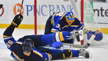 ST. LOUIS, MO - OCTOBER 30: St. Louis Blues defenseman Colton Parayko (55) falls on the ice as St. Louis Blues goalie Jake Allen (34) makes a save during a National Hockey League game between the Los Angeles Kings and the St. Louis Blues on October 30, 2017, at Scottrade Center, St. Louis, MO. (Photo by Keith Gillett/Icon Sportswire via Getty Images)