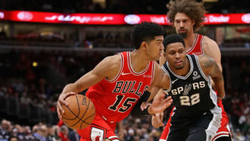 CHICAGO, ILLINOIS - NOVEMBER 26: Chandler Hutchison #15 of the Chicago Bulls moves against Rudy Gay #22 of the San Antonio Spurs at the United Center on November 26, 2018 in Chicago, Illinois. NOTE TO USER: User expressly acknowledges and agrees that, by downloading and or using this photograph, User is consenting to the terms and conditions of the Getty Images License Agreement. (Photo by Jonathan Daniel/Getty Images)