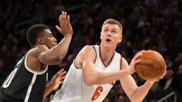 Dec 4, 2015; New York, NY, New York Knicks forward Kristaps Porzingis (6) being defended by Brooklyn Nets forward Thaddeus Young (30) in the second half at Madison Square Garden. The Knicks win 108-91. Mandatory Credit: William Hauser-USA TODAY Sports