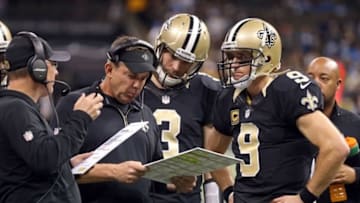 Dec 21, 2015; New Orleans, LA, USA; New Orleans Saints head coach Sean Payton talks to quarterback Drew Brees (9) and quarterback Matt Flynn (3) in the fourth quarter against the Detroit Lions at the Mercedes-Benz Superdome. Mandatory Credit: Chuck Cook-USA TODAY Sports
