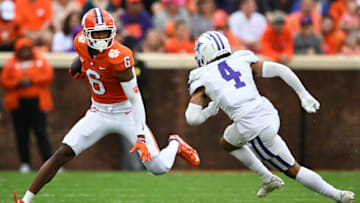 CLEMSON, SOUTH CAROLINA - SEPTEMBER 10: E.J. Williams #6 of the Clemson Tigers runs with the ball against Dominic Morris #4 of the Furman Paladins in the first quarter at Memorial Stadium on September 10, 2022 in Clemson, South Carolina. (Photo by Eakin Howard/Getty Images)