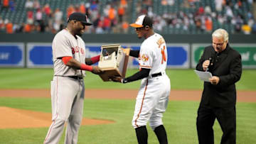 Sep 22, 2016; Baltimore, MD, USA; Boston Red Sox designated hitter David Ortiz (34) is presented with a broken phone by Baltimore Orioles outfielder Adam Jones (10) prior to the game at Oriole Park at Camden Yards. Mandatory Credit: Evan Habeeb-USA TODAY Sports