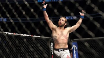 Dec 10, 2016; Toronto, ON, CAN; Lando Vannata (blue gloves) reacts to fight with John Makdessi (red gloves) during UFC 206 at Air Canada Centre. Mandatory Credit: Tom Szczerbowski-USA TODAY Sports