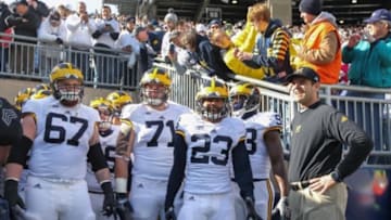 Nov 21, 2015; University Park, PA, USA; Michigan Wolverines head coach Jim Harbaugh waits to take the field with his team prior to the game against the Penn State Nittany Lions at Beaver Stadium. Mandatory Credit: Matthew O