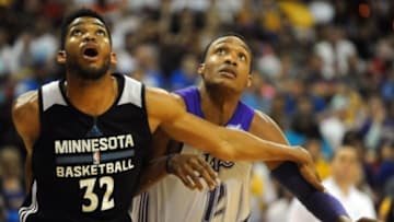 Jul 10, 2015; Las Vegas, NV, USA; Los Angeles Lakers center Robert Upshaw (12) is blocked out by Minnesota Timberwolves forward Karl-Anthony Towns (32) during an NBA Summer League game at Thomas & Mack Center. Mandatory Credit: Stephen R. Sylvanie-USA TODAY Sports