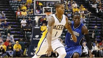 Oct 8, 2015; Indianapolis, IN, USA; Indiana Pacers guard Joe Young (1) dribbles the ball around Orlando Magic guard Victor Oladipo (5) at Bankers Life Fieldhouse. The Pacers won 97-92. Mandatory Credit: Brian Spurlock-USA TODAY Sports