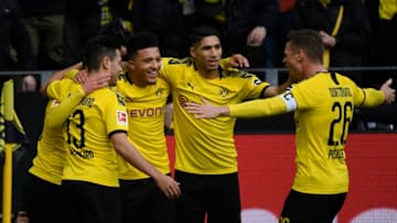 Dortmund's players celebrate a goal during the German first division Bundesliga football match Borussia Dortmund v SC Freiburg on February 29, 2020 in Dortmund. (Photo by Ina FASSBENDER / AFP) / DFL REGULATIONS PROHIBIT ANY USE OF PHOTOGRAPHS AS IMAGE SEQUENCES AND/OR QUASI-VIDEO (Photo by INA FASSBENDER/AFP via Getty Images)