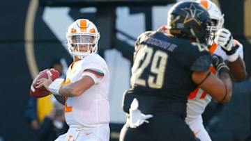 NASHVILLE, TN - NOVEMBER 24: Quarterback Jarrett Guarantano #2 of the Tennessee Volunteers drops back to throw a pass against Louis Vecchio #29 of the Vanderbilt Commodores during the first half at Vanderbilt Stadium on November 24, 2018 in Nashville, Tennessee. (Photo by Frederick Breedon/Getty Images)