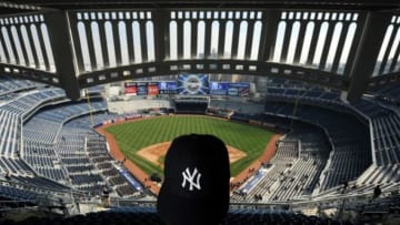 UNITED STATES - APRIL 02: Andrew Hartz checks out the view from the top row behind home plate as fans enter the stadium to watch the New York Yankees work out in the new Yankee Stadium for the first time. (Photo by Ron Antonelli/NY Daily News Archive via Getty Images)