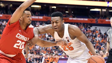 Dec 27, 2016; Syracuse, NY, USA; Syracuse Orange guard Tyus Battle (25) drives the ball on the baseline as Cornell Big Red guard Wil Bathurst (20) defends during the second half of a game at the Carrier Dome. Syracuse won 80-56. Mandatory Credit: Mark Konezny-USA TODAY Sports