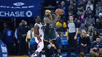 DeMarcus Cousins #0 of the Golden State Warriors looks to pass the ball over the top of Bam Adebayo #13 of the Miami Heat (Photo by Thearon W. Henderson/Getty Images)
