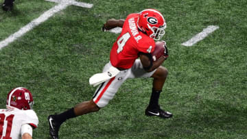 ATLANTA, GA - JANUARY 08: Mecole Hardman #4 of the Georgia Bulldogs carries the ball against the Alabama Crimson Tide in the CFP National Championship presented by AT&T at Mercedes-Benz Stadium on January 8, 2018 in Atlanta, Georgia. (Photo by Scott Cunningham/Getty Images)