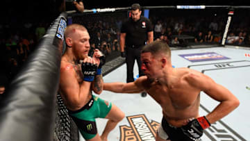 LAS VEGAS, NV - AUGUST 20: (R-L) Nate Diaz punches Conor McGregor of Ireland in their welterweight bout during the UFC 202 event at T-Mobile Arena on August 20, 2016 in Las Vegas, Nevada. (Photo by Josh Hedges/Zuffa LLC/Zuffa LLC via Getty Images)