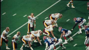MINNEAPOLIS, MN - JANUARY 26: Quarterback Mark Rypien #11 of the Washington Redskins sets the offense against the Buffalo Bills in Super Bowl XXVI at the Metrodome on January 26, 1992 in Minneapolis, Minnesota. The Redskins defeated the Bills 37-24. (Photo by Gin Ellis/Getty Images)