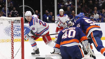 UNIONDALE, NEW YORK - JANUARY 16: Chris Kreider #20 of the New York Rangers scores the game winning goal on the power-play at 19:35 of the third period against the New York Islanders at NYCB Live's Nassau Coliseum on January 16, 2020 in Uniondale, New York. The Rangers defeated the Islanders 3-2. (Photo by Bruce Bennett/Getty Images)