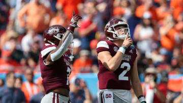 Jan 2, 2023; Tampa, FL, USA; Mississippi State Bulldogs quarterback Will Rogers (2) and running back Jo'quavious Marks (7) pause to pay tribute to former teach cook Mike Leach at the star of the game against the Illinois Fighting Illini during the 2023 ReliaQuest Bowl at Raymond James Stadium. Mandatory Credit: Nathan Ray Seebeck-USA TODAY Sports