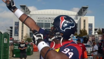 Nov 17, 2013; Houston, TX, USA; Houston Texans fan Herman Eagleton poses in a uniform and helmet during tailgate festivities before the game against the Oakland Raiders at Reliant Stadium. Mandatory Credit: Kirby Lee-USA TODAY Sports