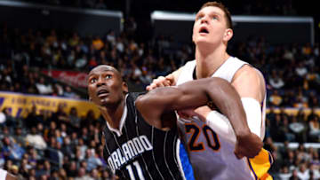 LOS ANGELES, CA - JANUARY 8: Bismack Biyombo #11 of the Orlando Magic fights for the position against Timofey Mozgov #20 of the Los Angeles Lakers on January 8, 2017 at STAPLES Center in Los Angeles, California. NOTE TO USER: User expressly acknowledges and agrees that, by downloading and/or using this Photograph, user is consenting to the terms and conditions of the Getty Images License Agreement. Mandatory Copyright Notice: Copyright 2017 NBAE (Photo by Andrew D. Bernstein/NBAE via Getty Images)