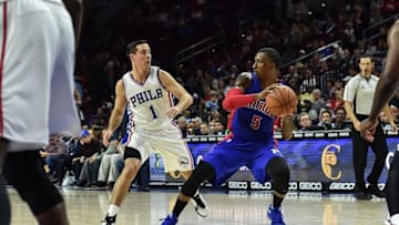 Oct 15, 2016; Philadelphia, PA, USA; Detroit Pistons guard Kentavious Caldwell-Pope (5) looks to pass as Philadelphia 76ers guard T.J. McConnell (1) defends during the second quarter of the preseason game at the Wells Fargo Center. Mandatory Credit: John Geliebter-USA TODAY Sports