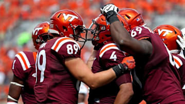 Sep 24, 2016; Blacksburg, VA, USA; Virginia Tech Hokies quarterback Jerod Evans (4) celebrates scoring a touchdown during the third quarter against the East Carolina Pirates at Lane Stadium. Mandatory Credit: Peter Casey-USA TODAY Sports