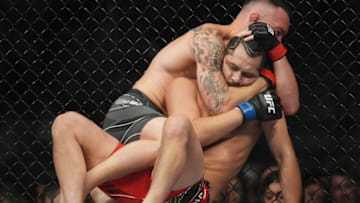Mar 5, 2022; Las Vegas, Nevada, UNITED STATES; Colby Covington (red gloves) fights Jorge Masvidal (blue gloves) during UFC 272 at T-Mobile Arena. Mandatory Credit: Stephen R. Sylvanie-USA TODAY Sports
