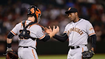 May 13, 2016; Phoenix, AZ, USA; San Francisco Giants relief pitcher Santiago Casilla (46) celebrates with catcher Buster Posey (28) after defeating the Arizona Diamondbacks 3-1 at Chase Field. Mandatory Credit: Joe Camporeale-USA TODAY Sports